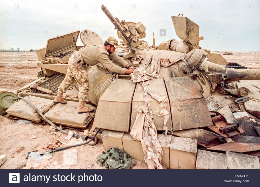 a-qatar-soldier-examines-a-destroyed-iraqi-t-55-battle-tank-during-FMAEHK.thumb.jpg.0060a584174d1fa32788c23acd7e5727.jpg