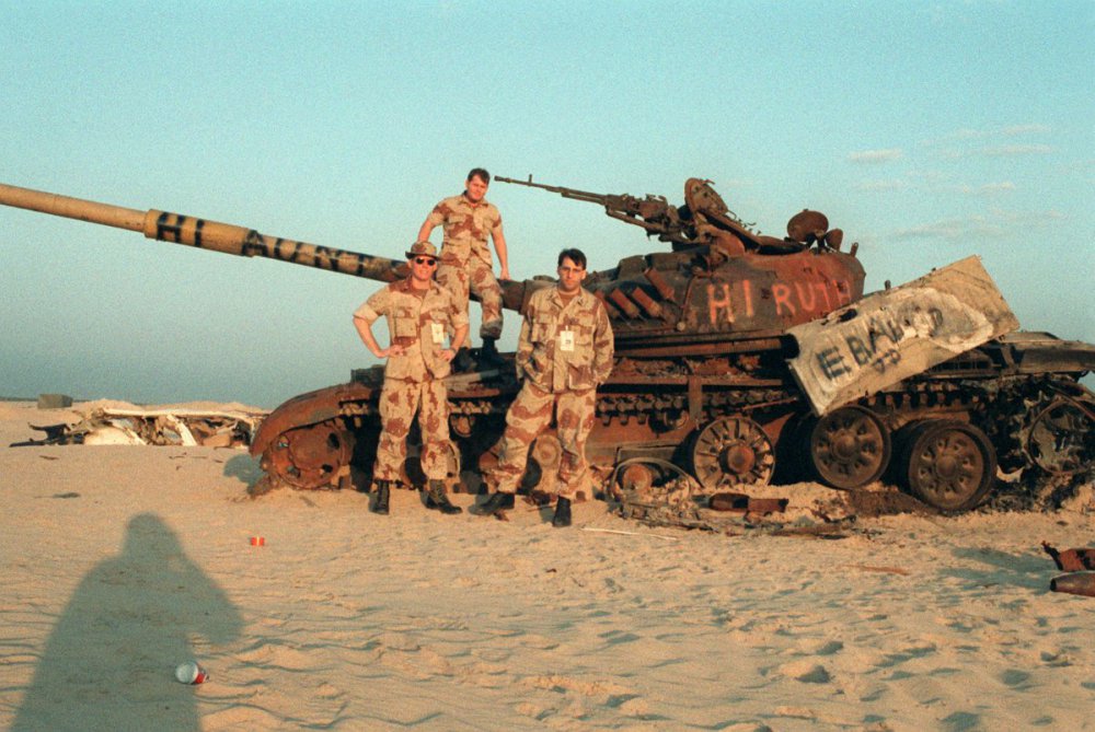 members-of-a-media-team-pose-in-front-of-an-iraqi-t-72-main-battle-tank-destroyed-9049d9-1600.jpg