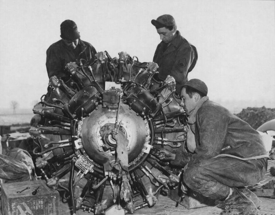 Groundcrewmenofthe354thfighter-bombergroupoftheNinthAirforcerepairaRepublicP-47Thunderboltengineintheopenairatafrontlineairf_zps95bf6b72.jpg