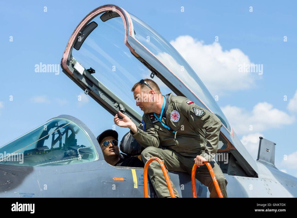 the-pilot-and-the-visitor-near-the-cockpit-of-the-multirole-fighter-GNKTDX.jpg